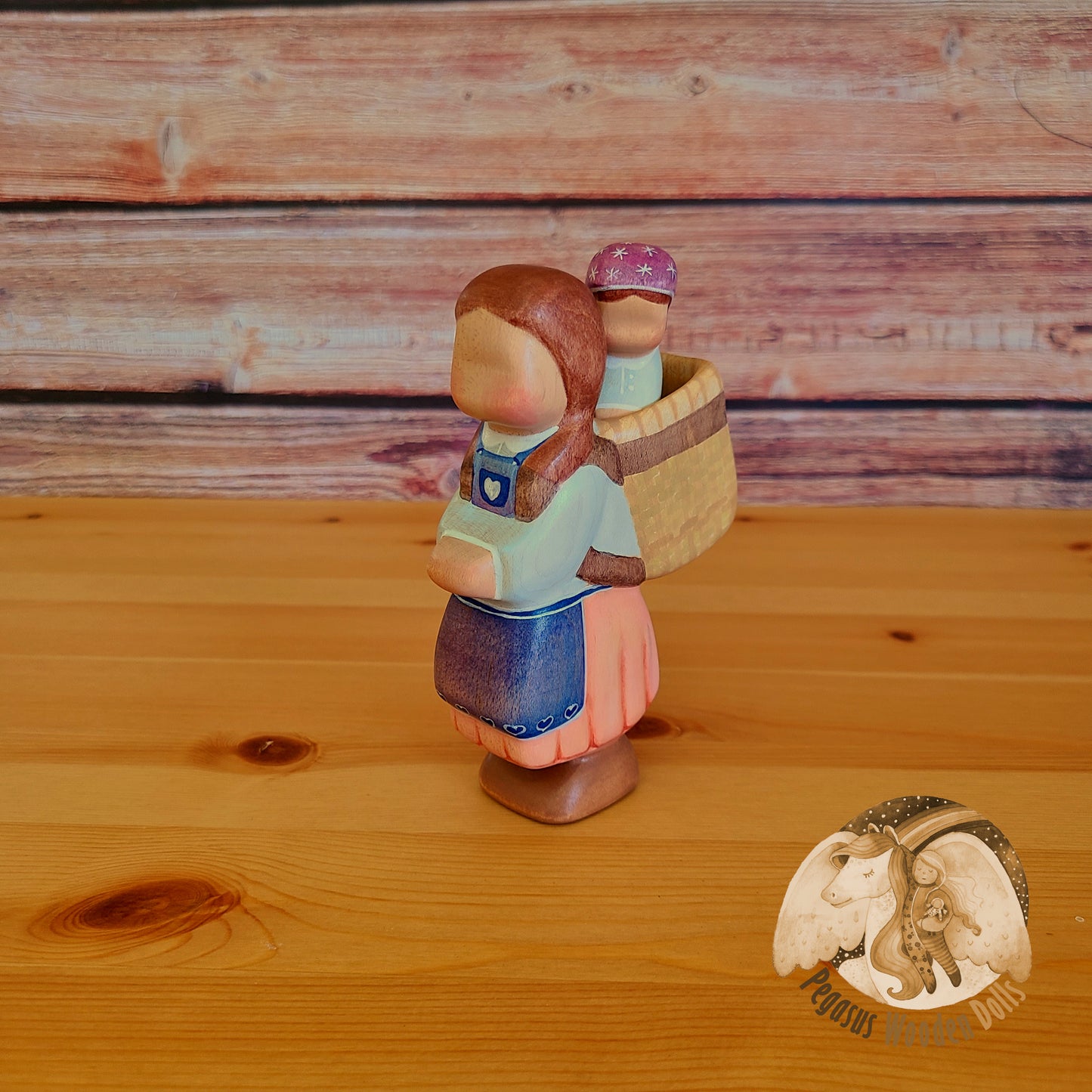 Wooden Mother with basket and baby