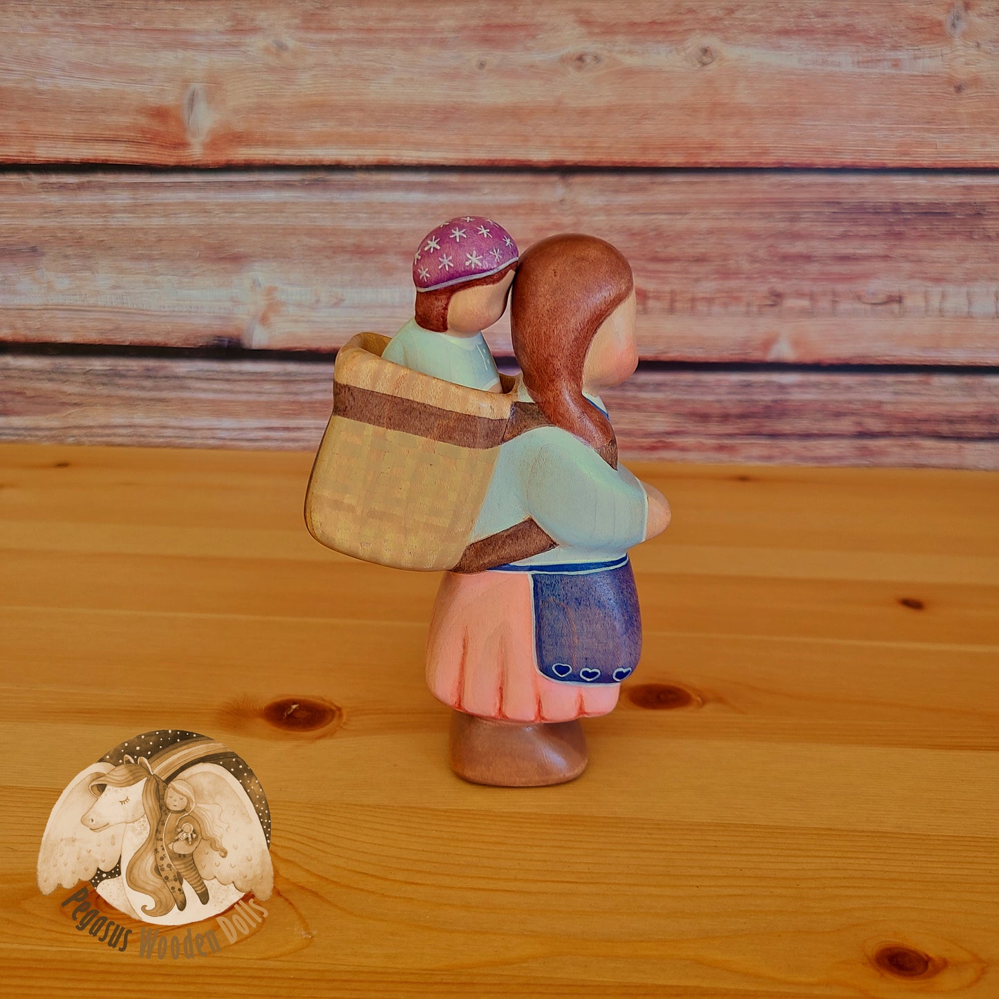 Wooden Mother with basket and baby