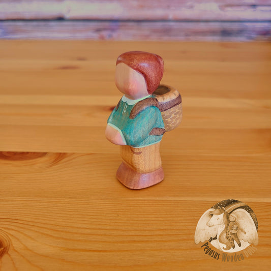 Wooden Standing Baby with basket (green shirt)