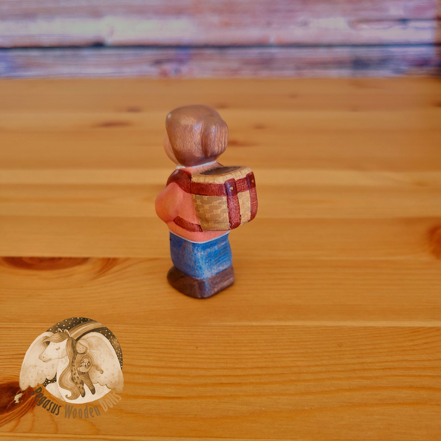 Wooden Standing Baby with basket (orange shirt)