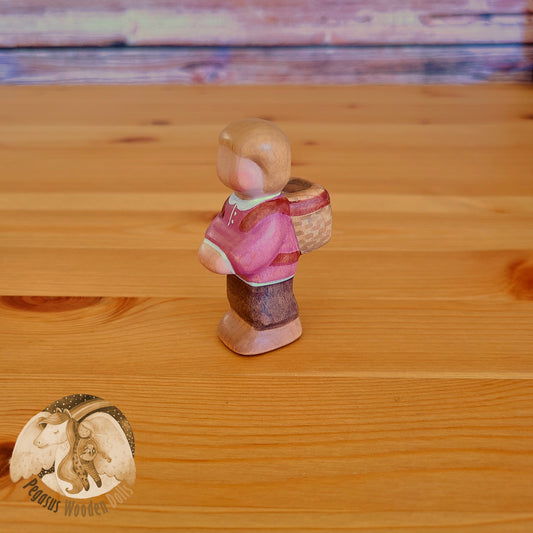 Wooden Standing Baby with basket (mauve shirt)