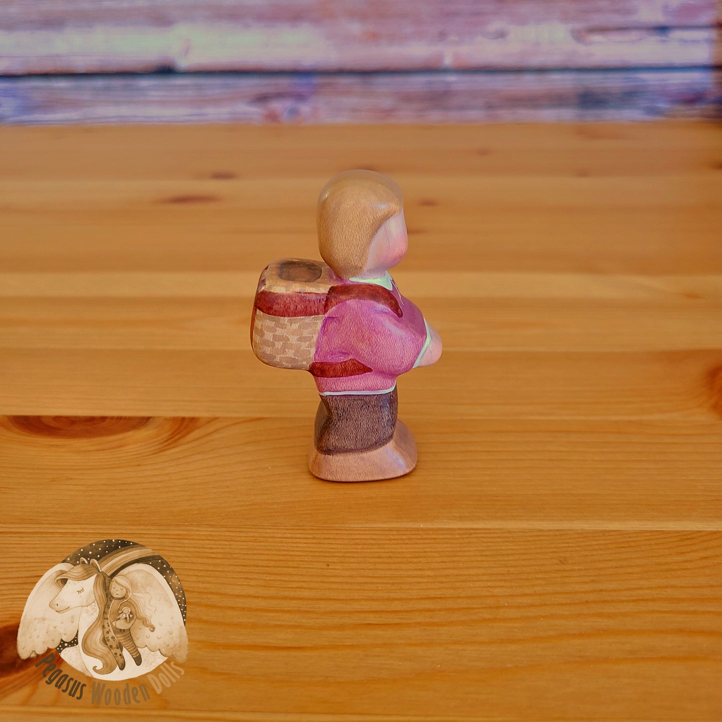 Wooden Standing Baby with basket (mauve shirt)