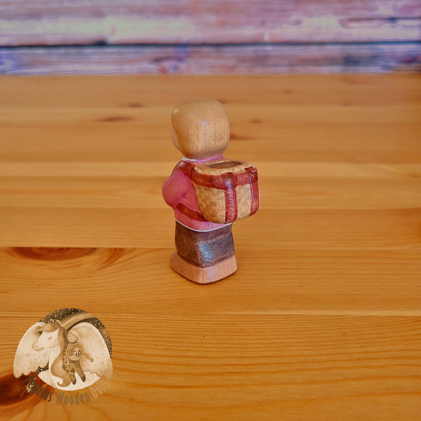 Wooden Standing Baby with basket (mauve shirt)