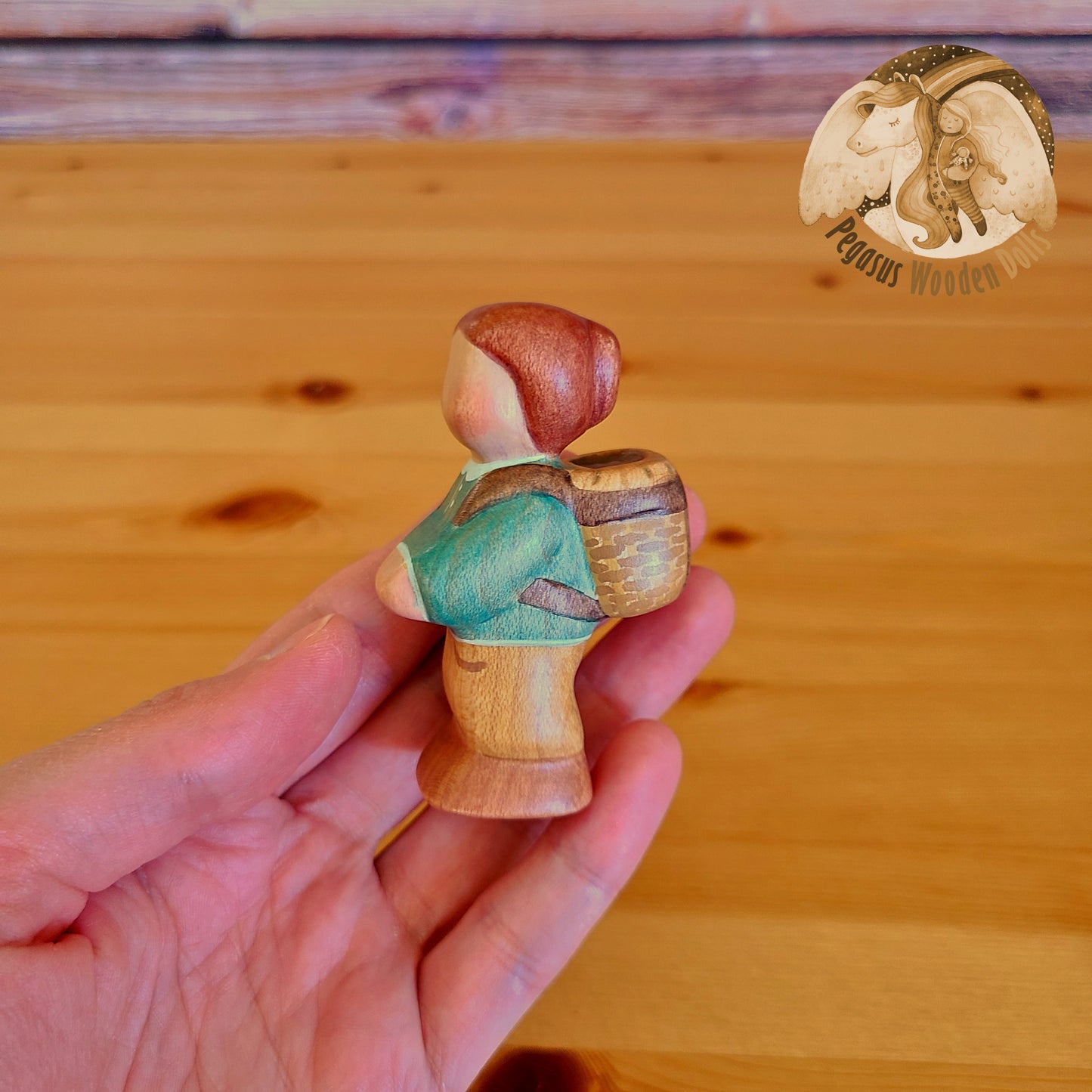 Wooden Standing Baby with basket (green shirt)