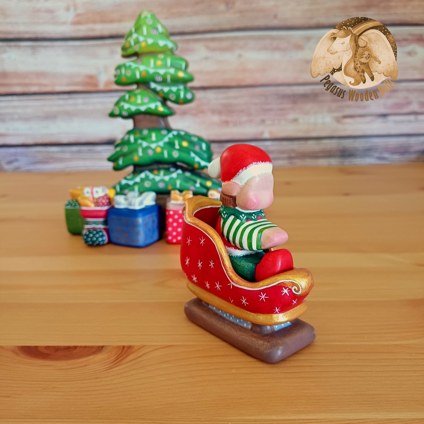 Wooden Winter Sitting Elf Baby in slide (brown hair)