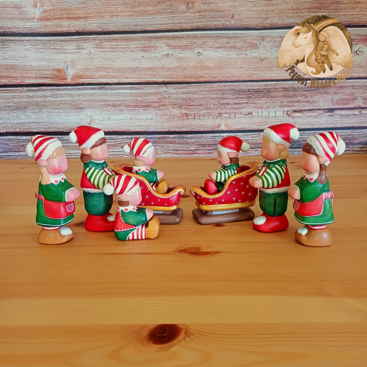 Wooden Winter Sitting Elf Baby in slide (brown hair)