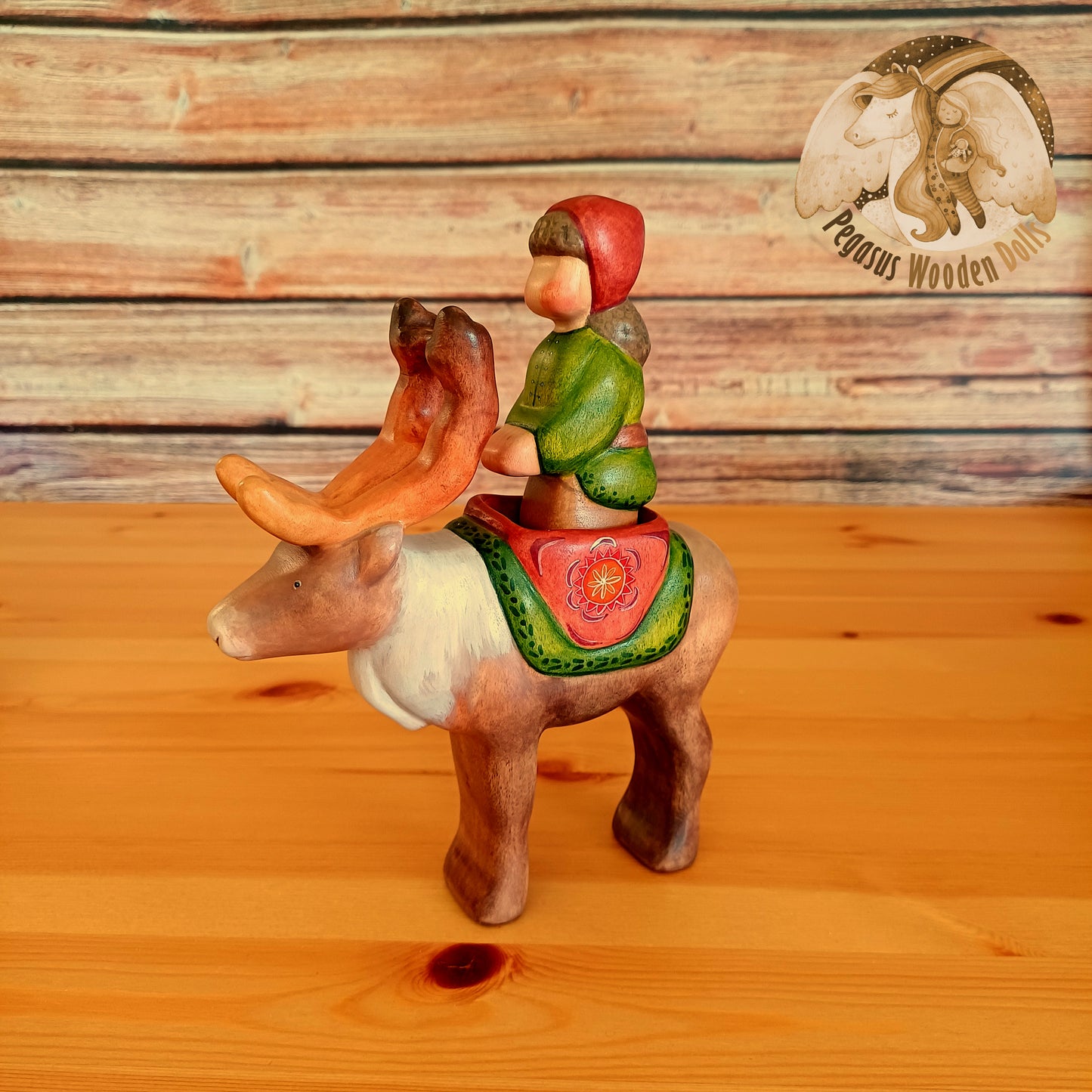 Wooden Reindeer with rider (brown hair)