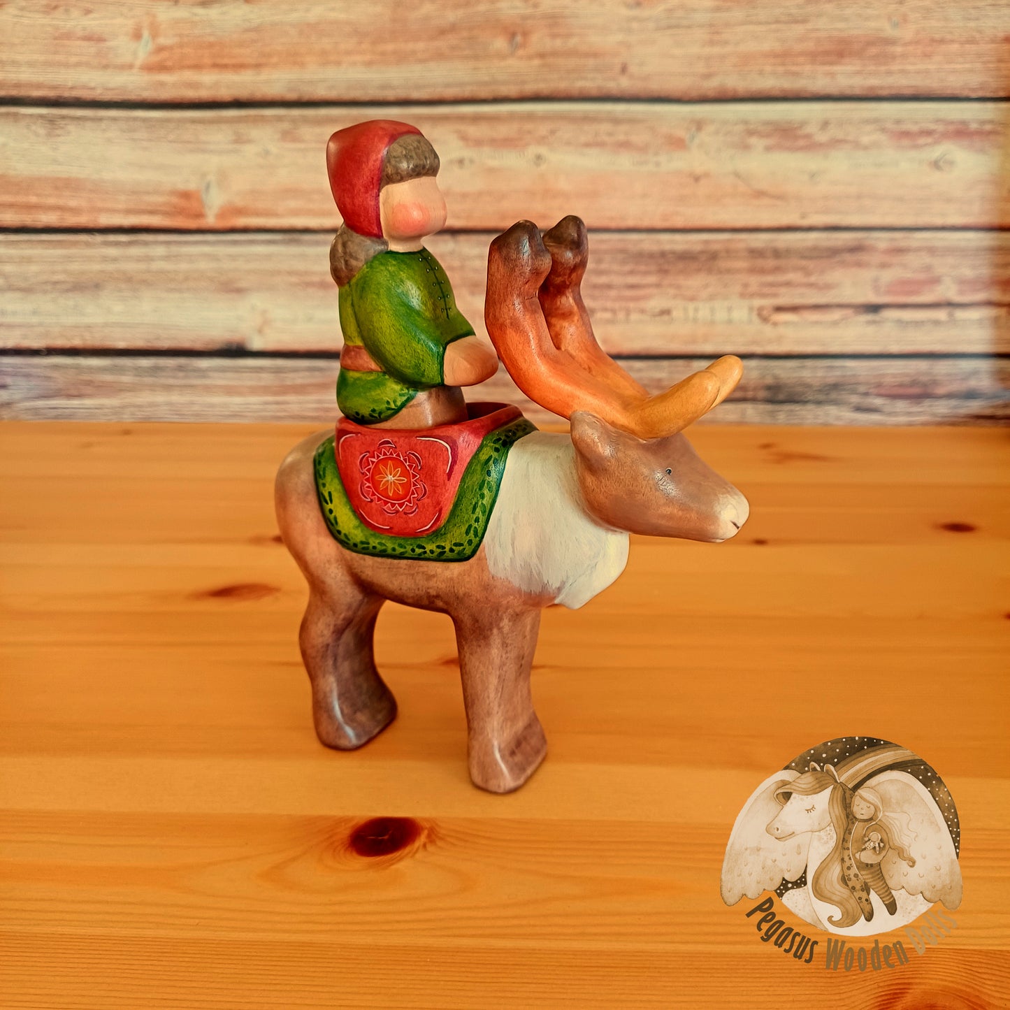 Wooden Reindeer with rider (brown hair)