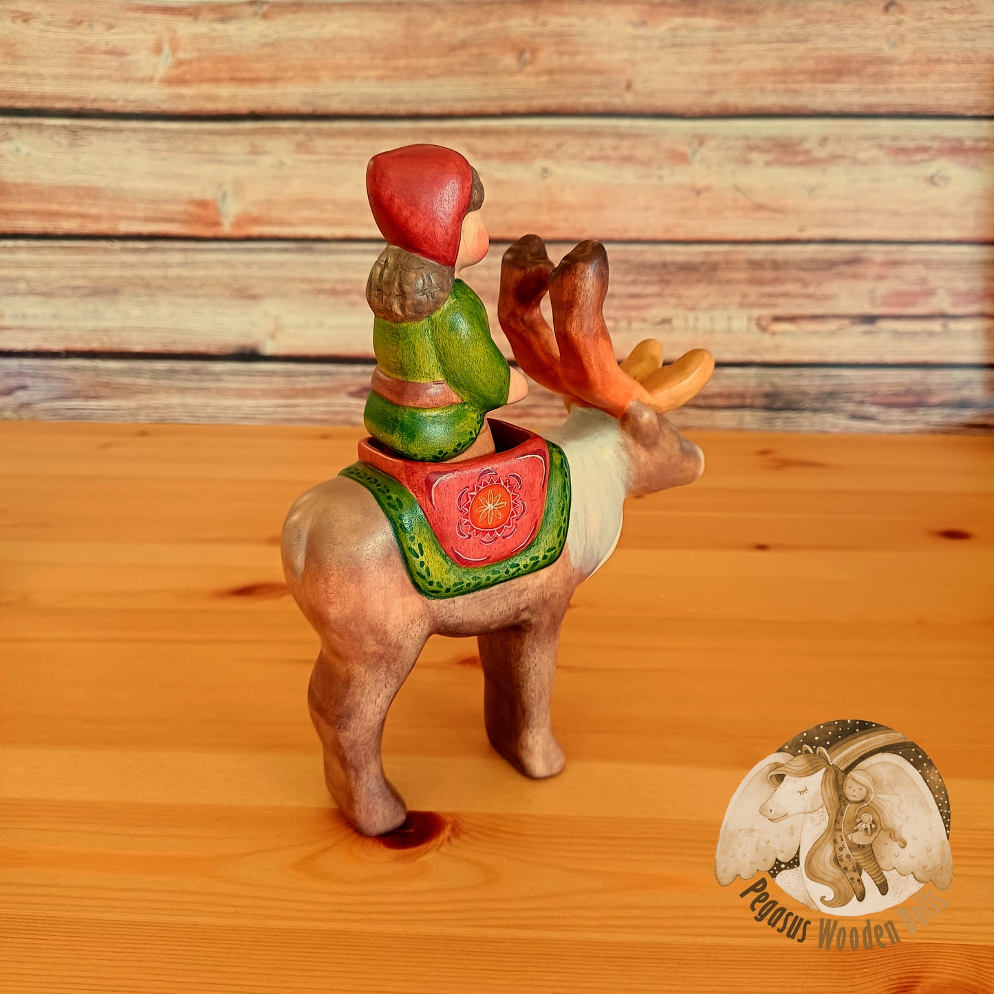 Wooden Reindeer with rider (brown hair)