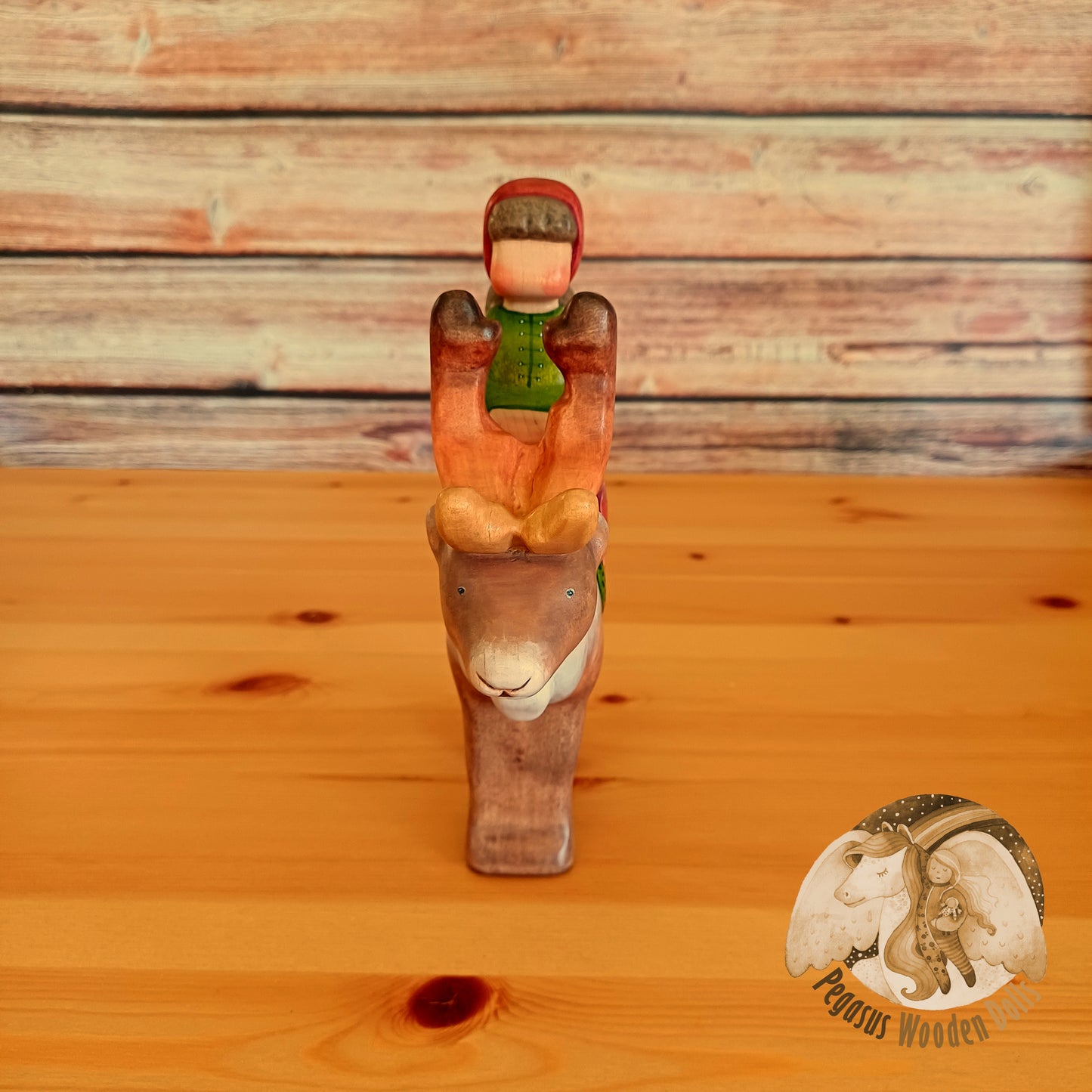 Wooden Reindeer with rider (brown hair)