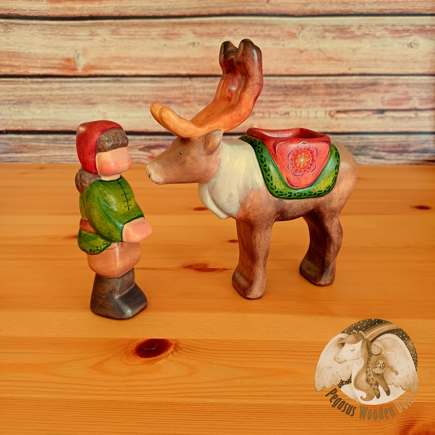 Wooden Reindeer with rider (brown hair)