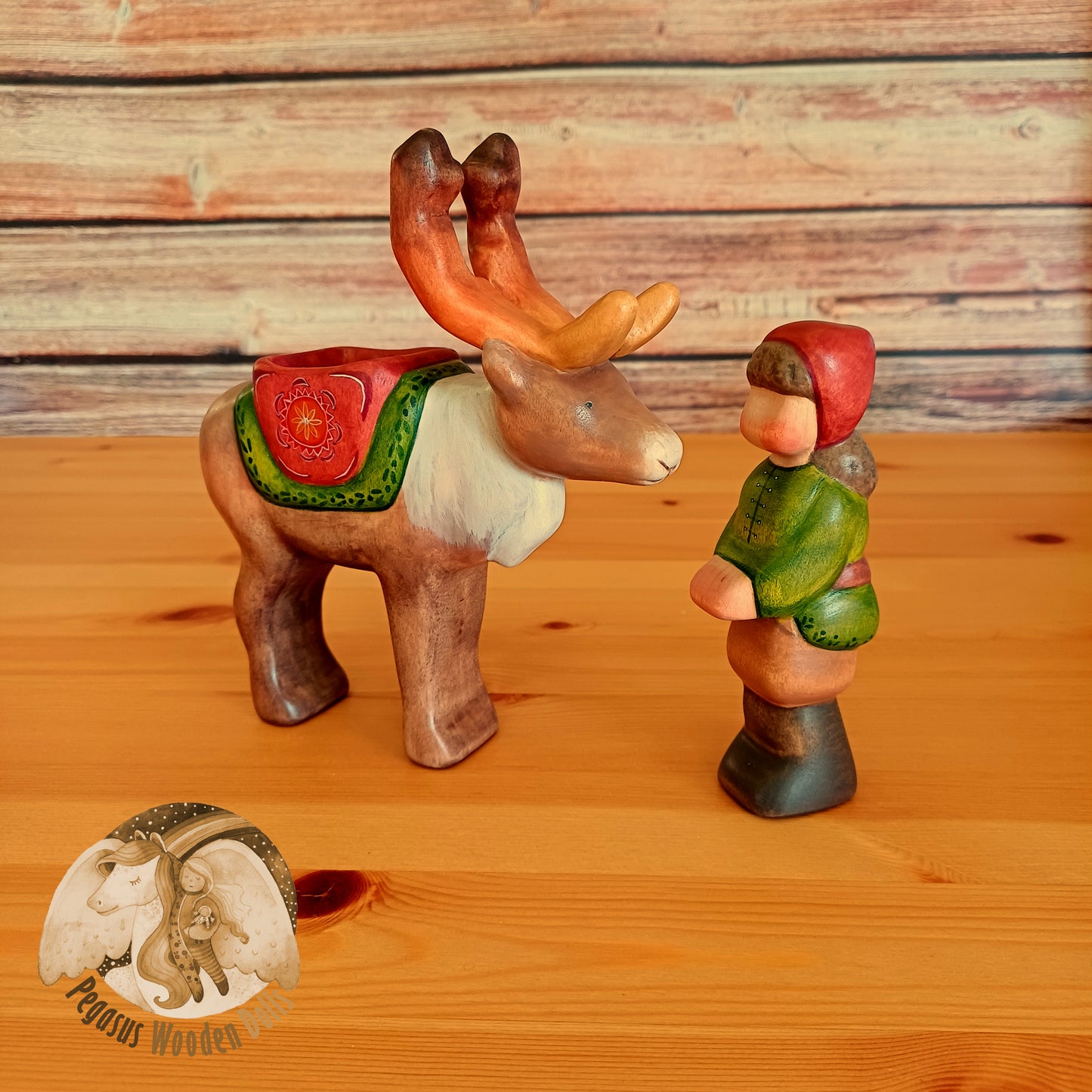 Wooden Reindeer with rider (brown hair)