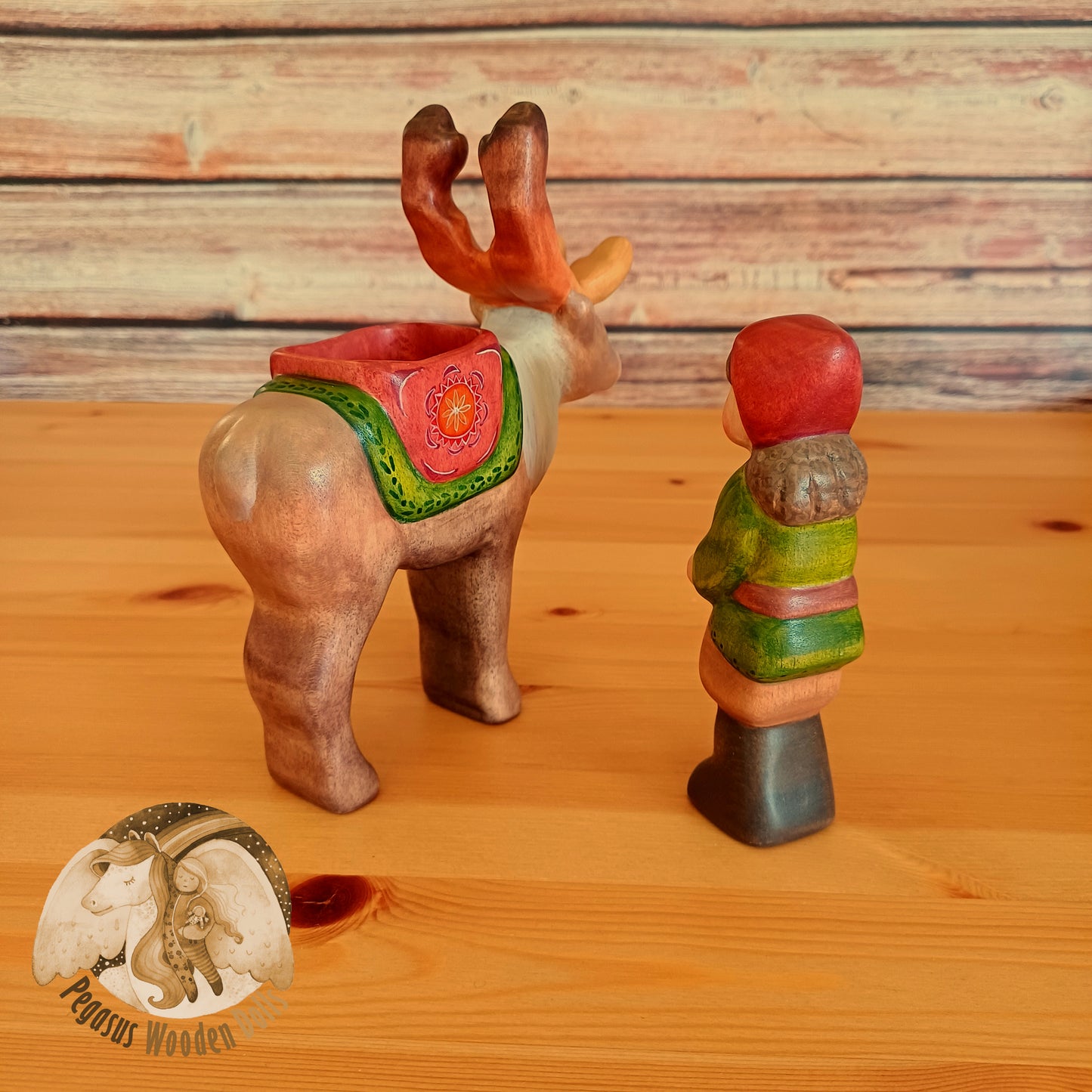 Wooden Reindeer with rider (brown hair)