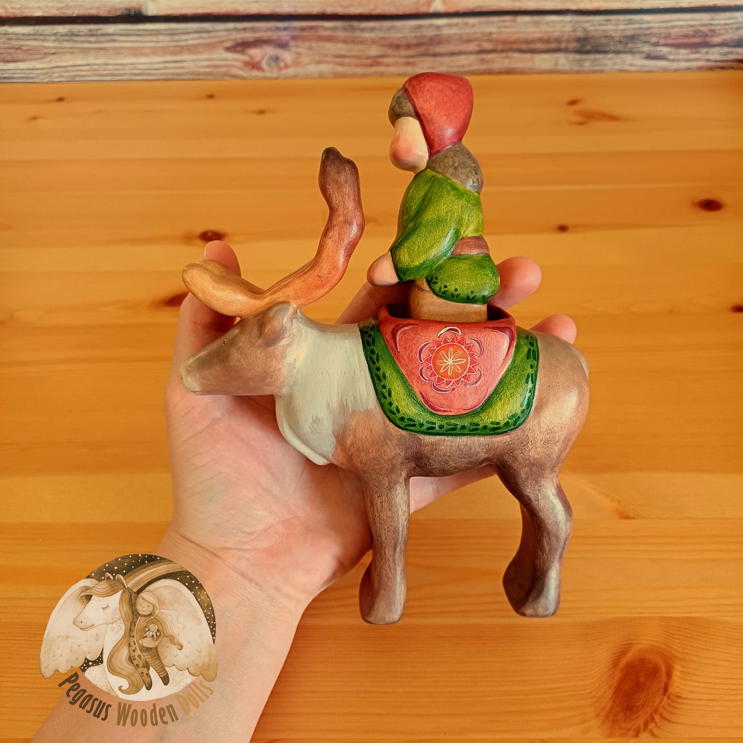 Wooden Reindeer with rider (brown hair)