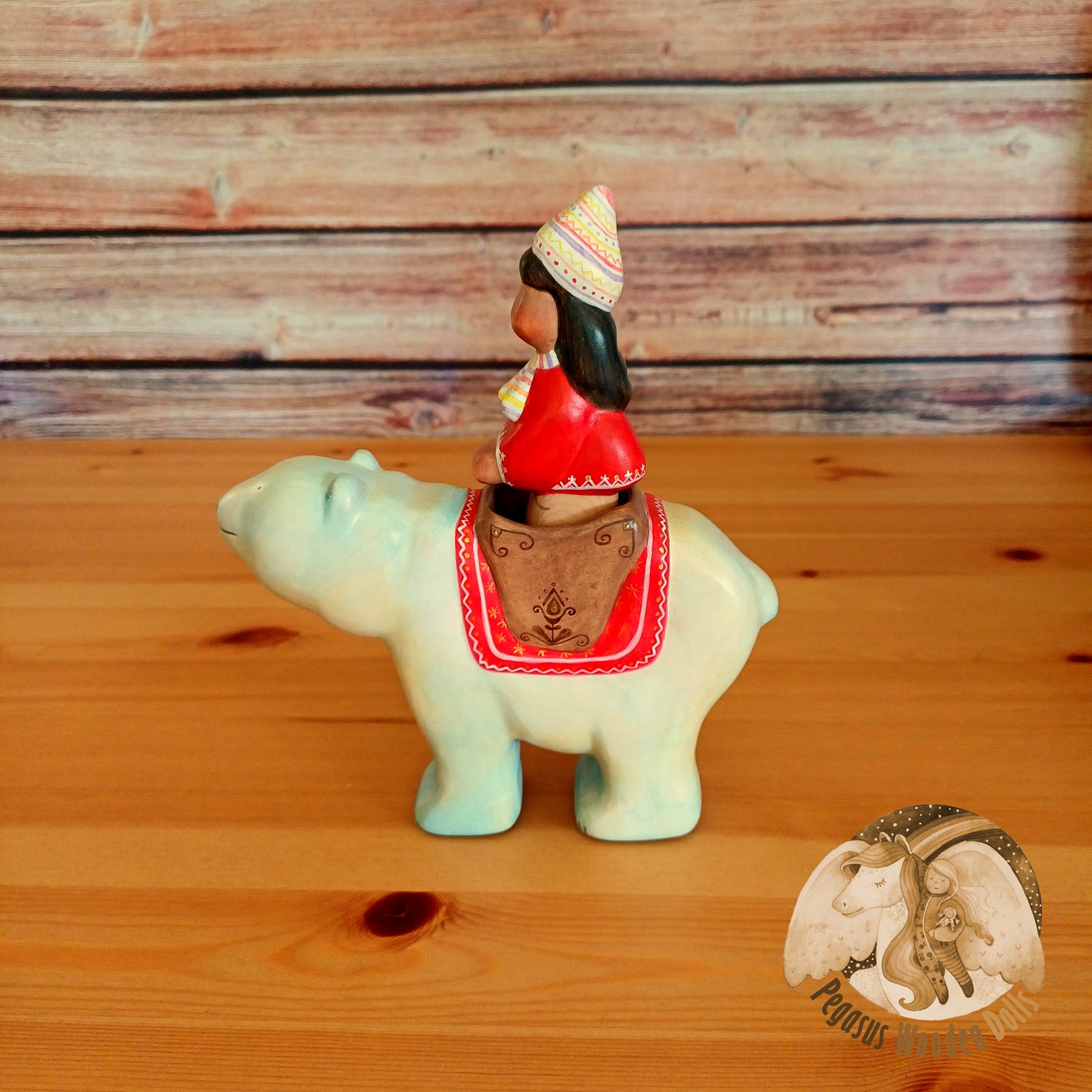 Wooden Polar Bear with rider (red)