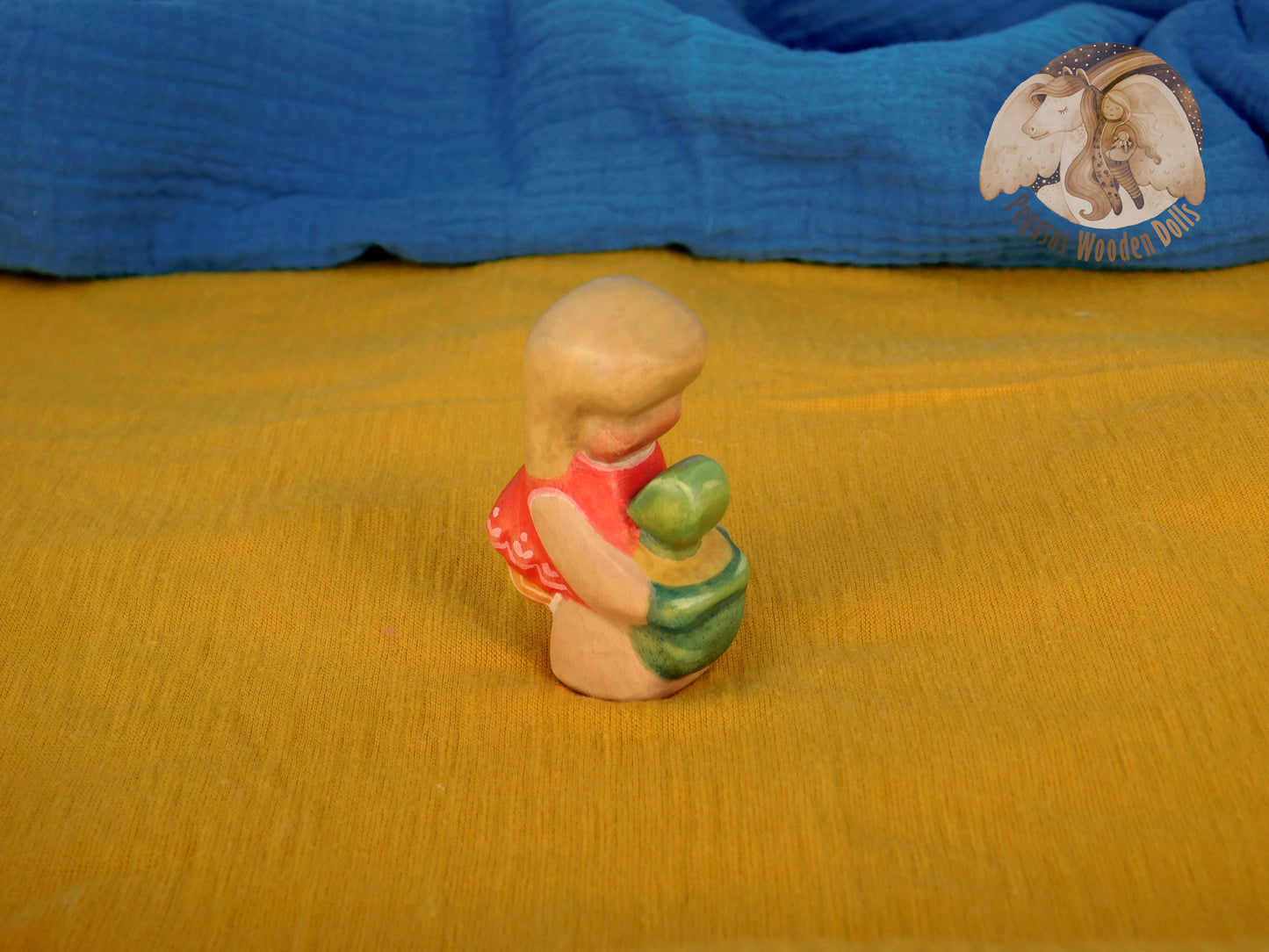 Wooden Squatting Baby in red dress with sand play set