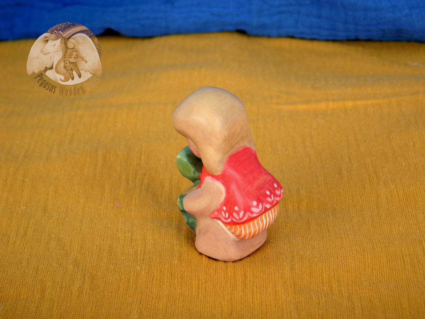 Wooden Squatting Baby in red dress with sand play set