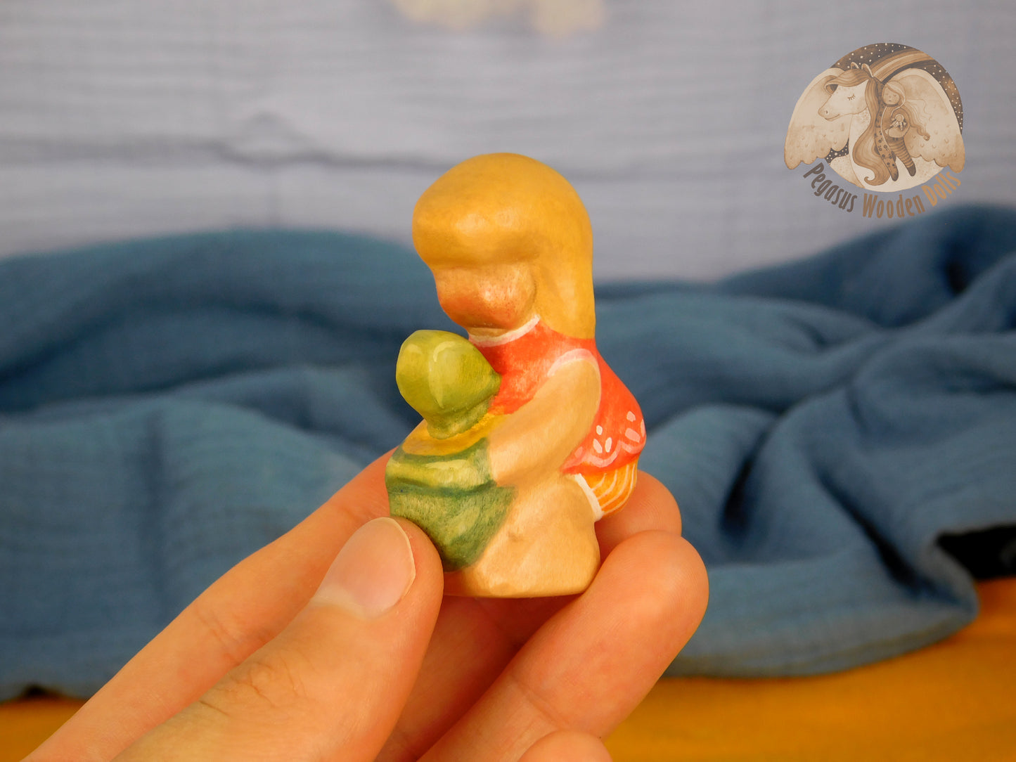 Wooden Squatting Baby in red dress with sand play set