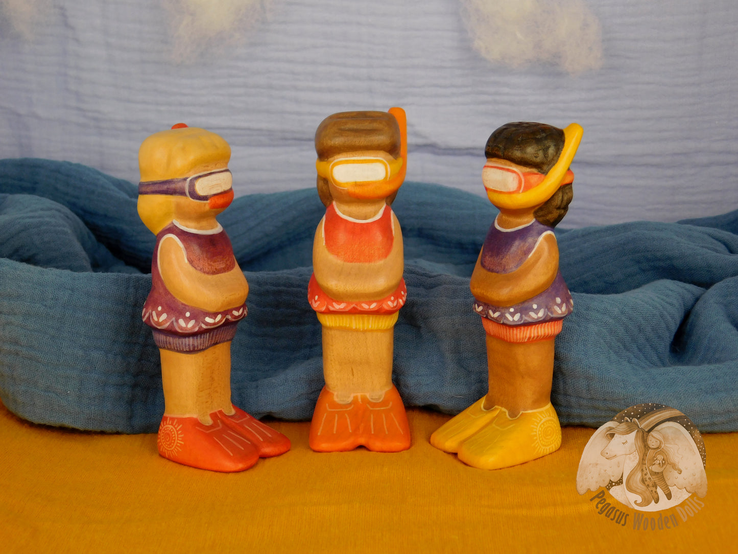 Wooden Snorkelling Girl figure in purple swimming dress