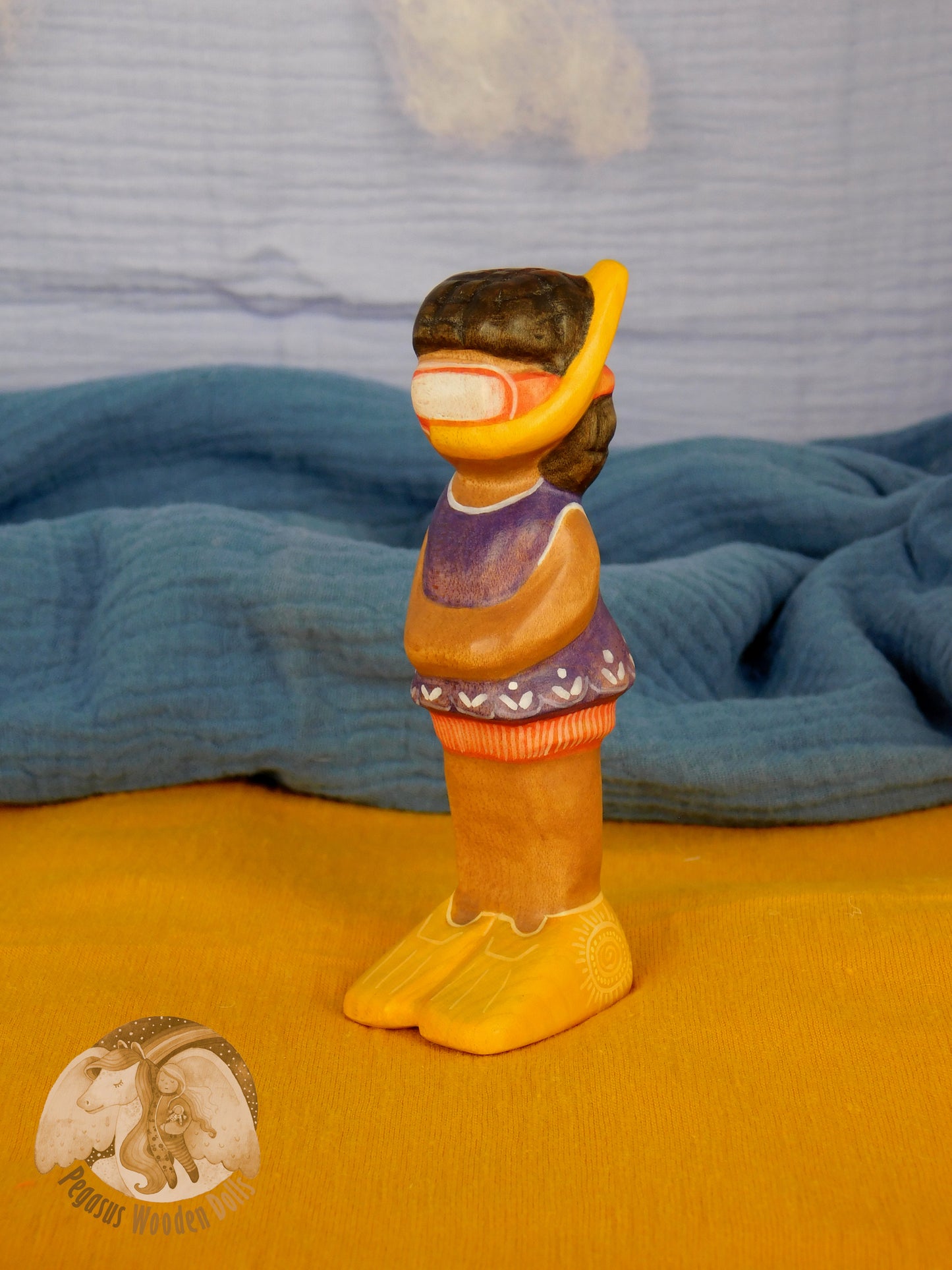 Wooden Snorkelling Girl figure in purple swimming dress