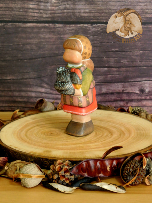 Wooden Girl with black chicken