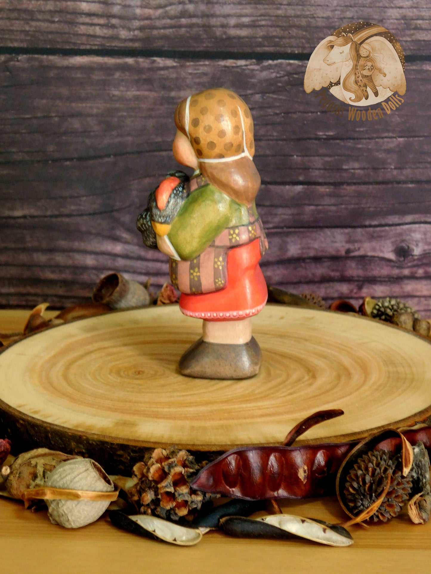 Wooden Girl with black chicken