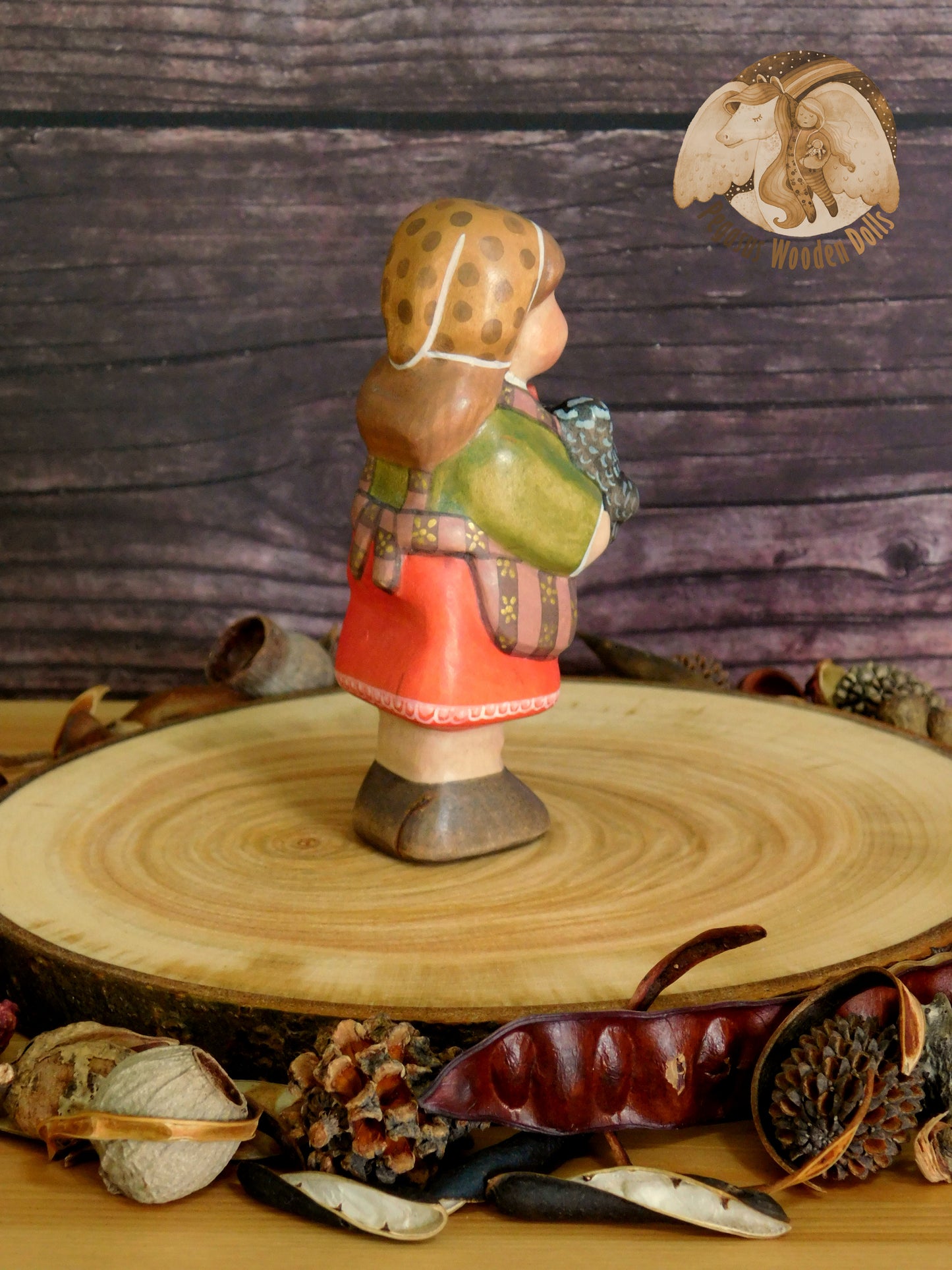 Wooden Girl with black chicken