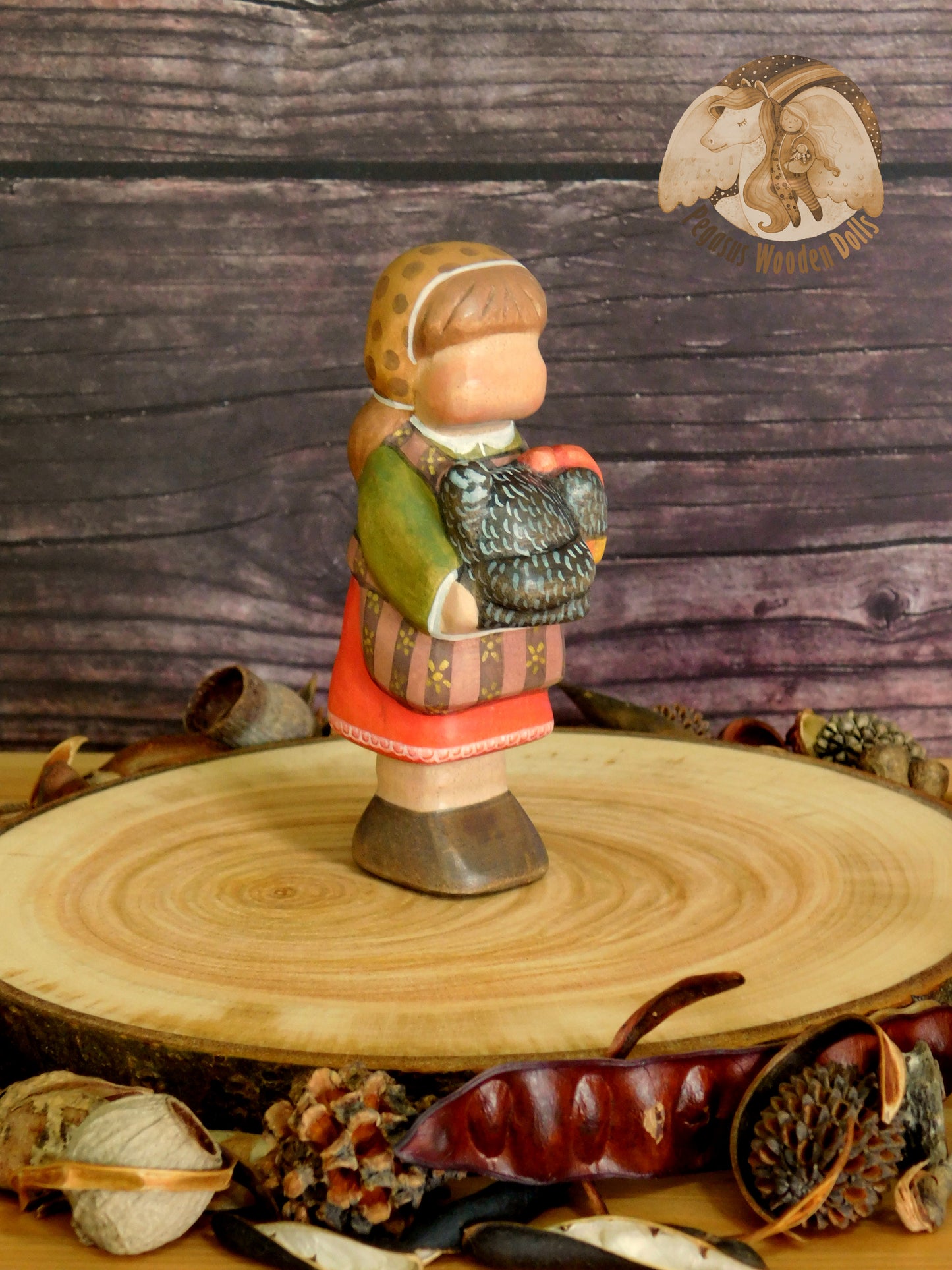 Wooden Girl with black chicken