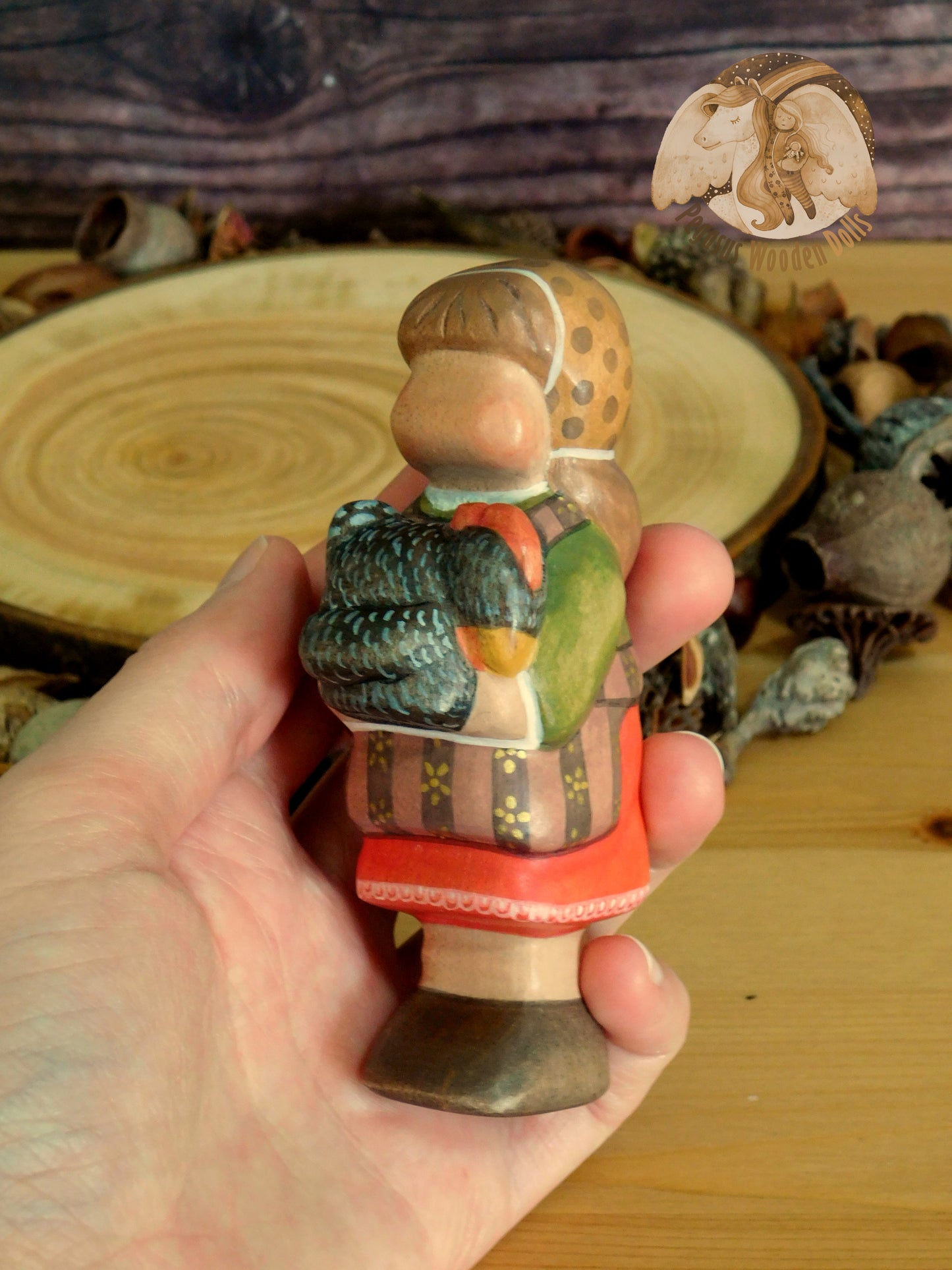 Wooden Girl with black chicken