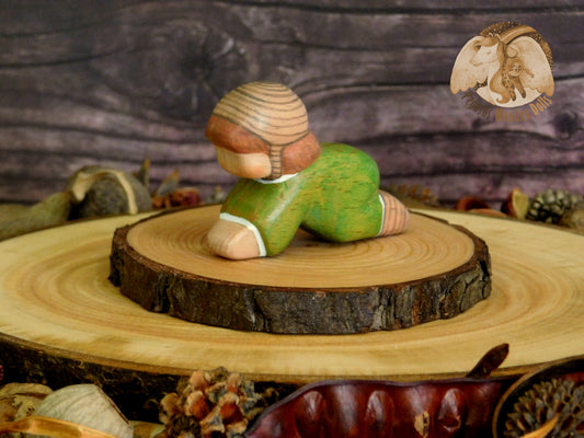 Wooden Crawling Baby in green clothes